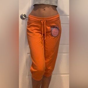 No Boundaries orange capris sweatpants.             “Live, Love, Laugh, + Peace”